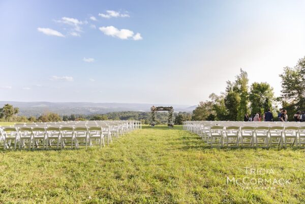 White padded ceremony chairs mahaiwe tent